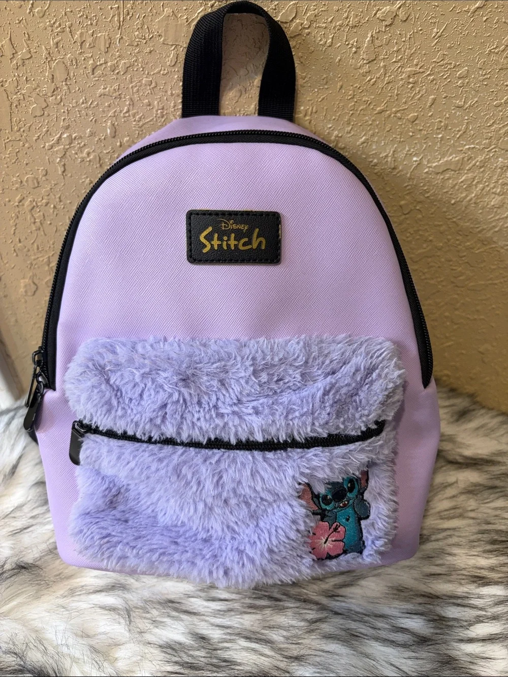 Disney Purple Stitch mini backpack with fuzzy front pocket and stitch patch